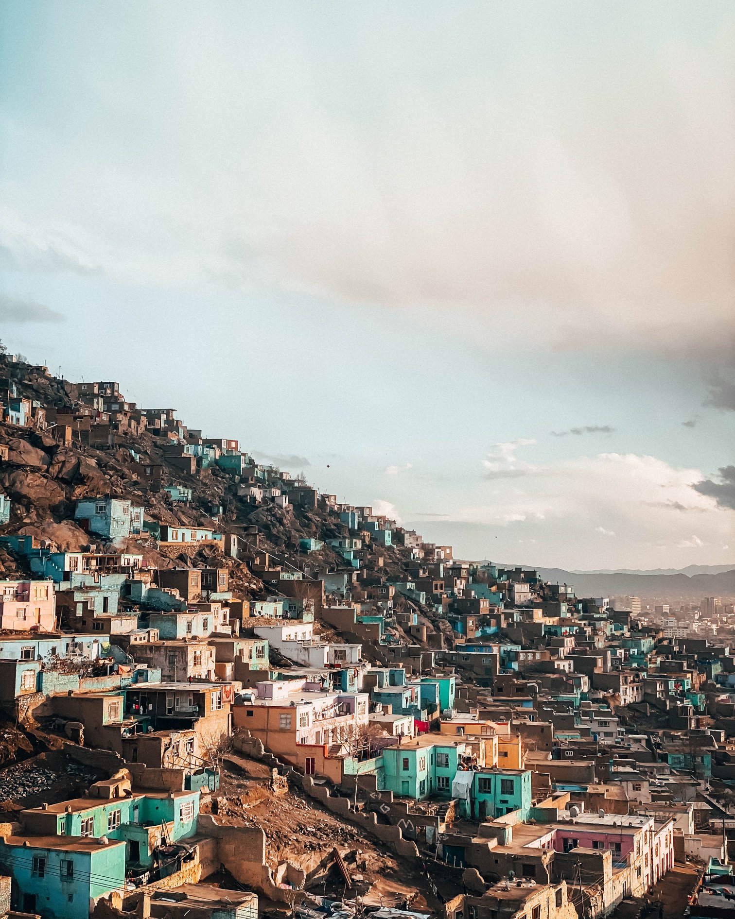 Old town with colorful buildings on hill slope